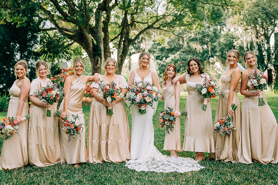 Large, vibrant floral displays, such as arched entrances or aisle decor. Stunning table centerpieces featuring bold, colorful flowers.
